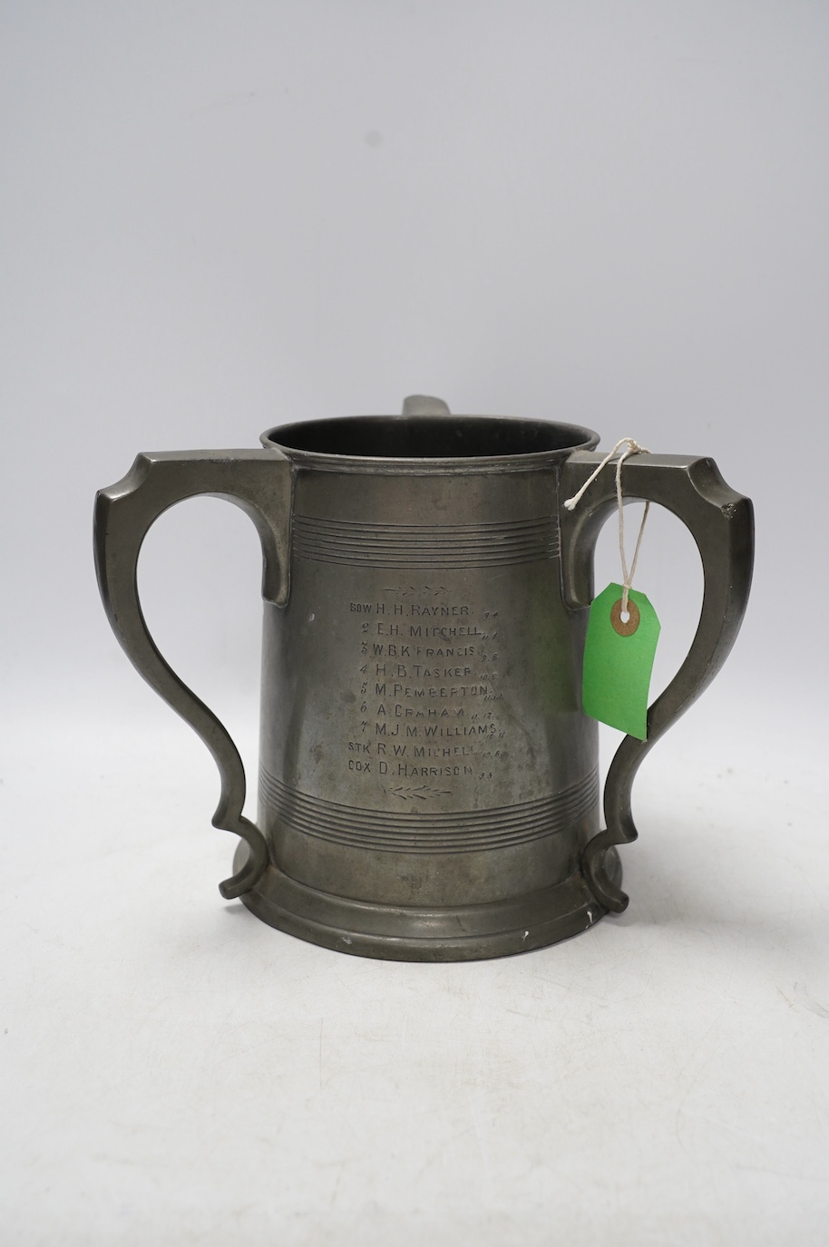 A 19th century pewter three handled rowing trophy from Caius College, 19cm. Condition - fair